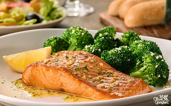 Herb grilled salmon fillet with seasoning and fresh herbs